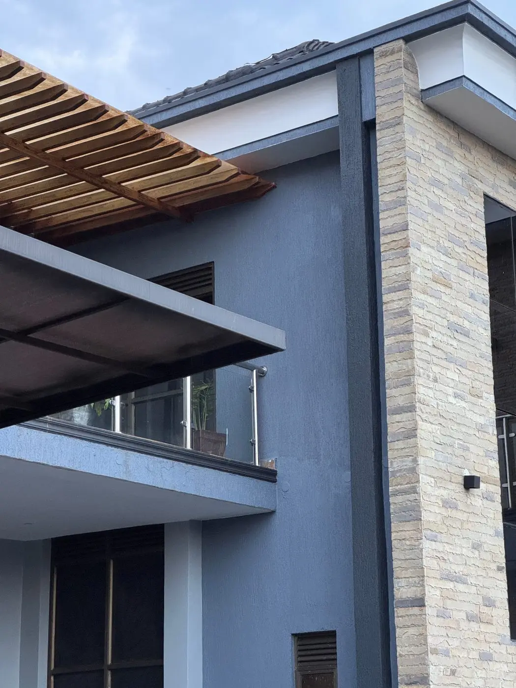 Finished house stone cladding pergola, Home remodel, fountain and landscaping, Jinja